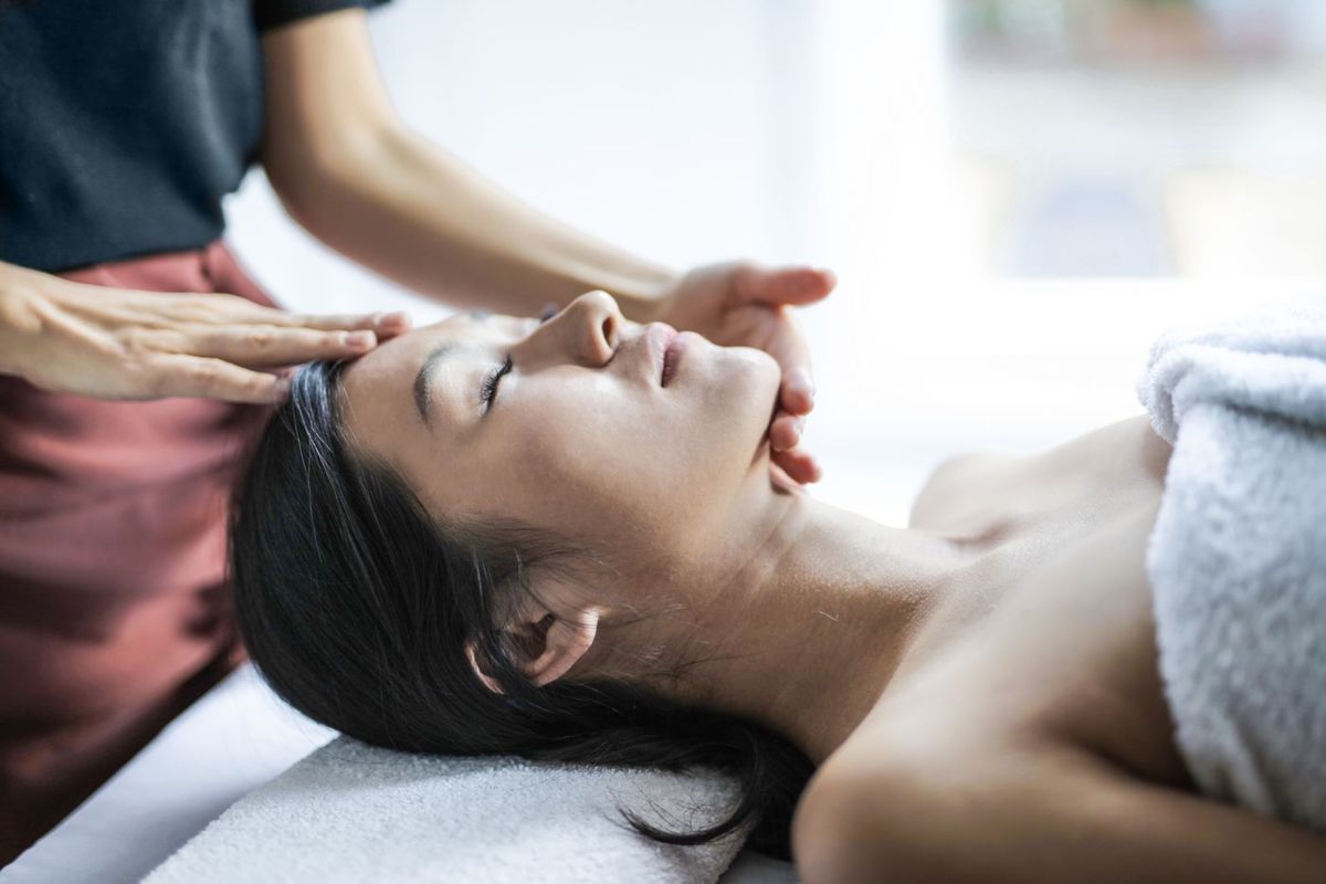Woman receiving a soothing head massage